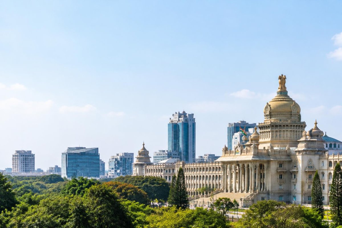 Illustrative Bengaluru cityscape with civic architecture and a modern business district
